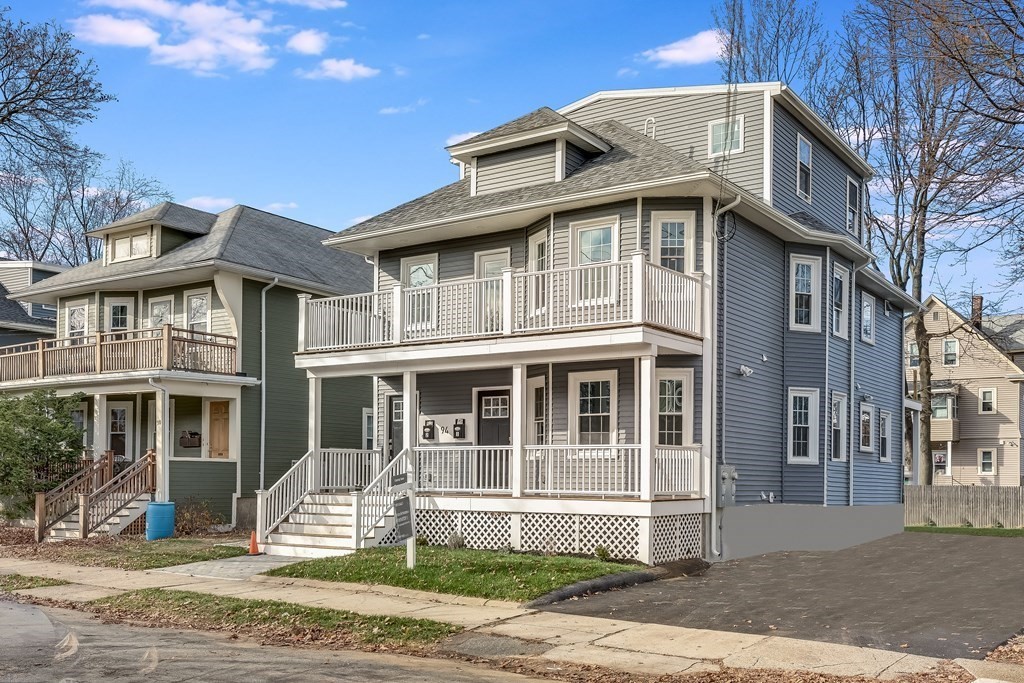 94 Marathon Street, Unit 1 Arlington, MA 02474 - Photo 22 of 24 a front view of a house with a yard
