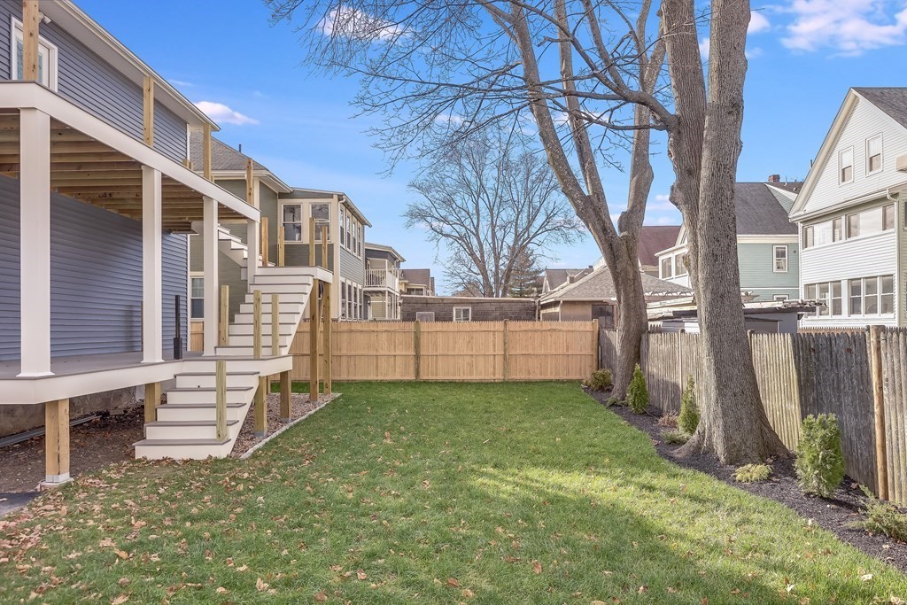 94 Marathon Street, Unit 1 Arlington, MA 02474 - Photo 23 of 24 a view of a house with a yard