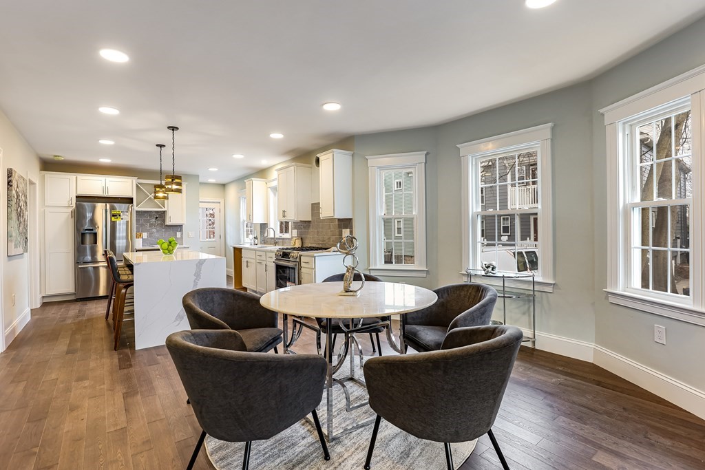 94 Marathon Street, Unit 1 Arlington, MA 02474 - Photo 4 of 24 a dining room with furniture and wooden floor