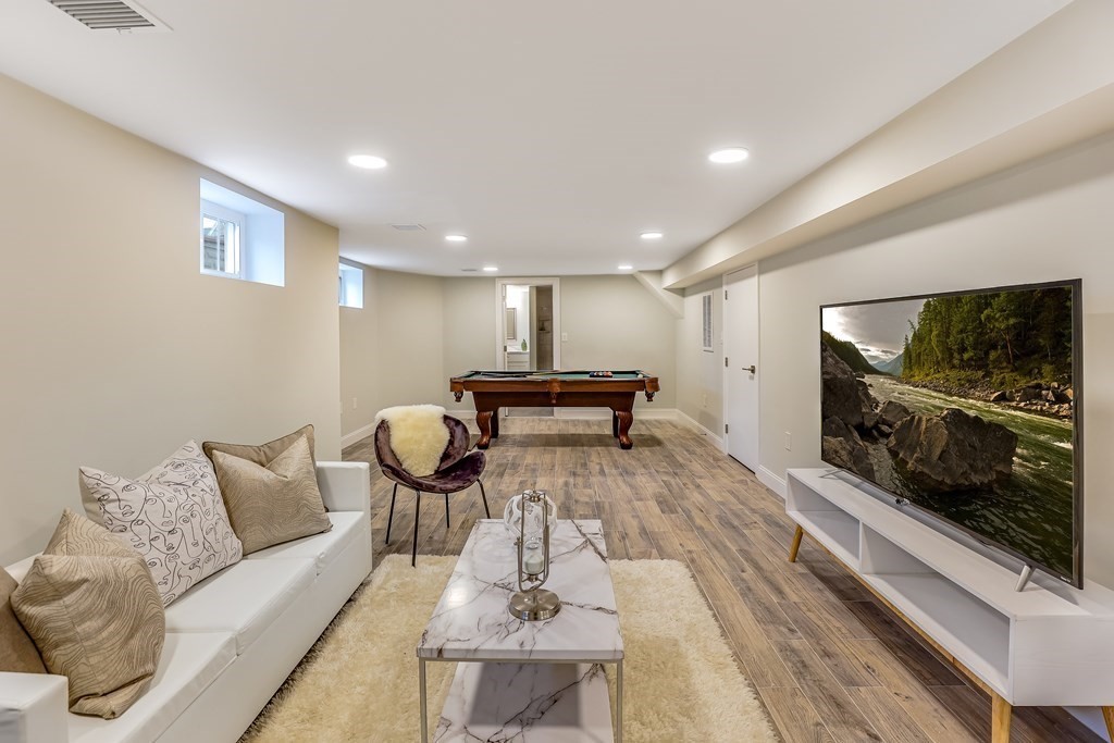 94 Marathon Street, Unit 1 Arlington, MA 02474 - Photo 10 of 24 a living room with furniture and a flat screen tv