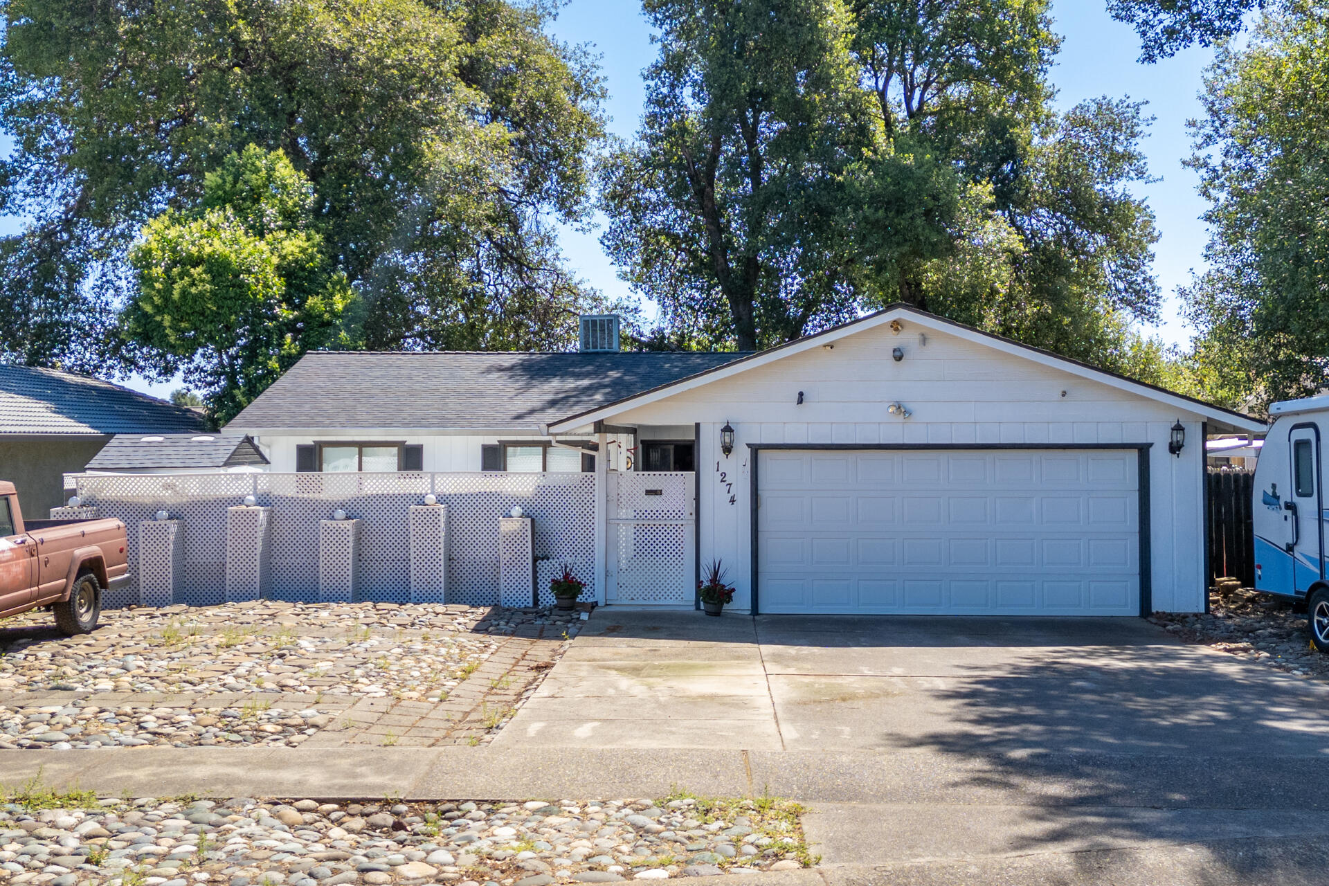 1274 Harpole Road Redding, CA 96002 - Photo 1 of 27 a front view of a house with a yard