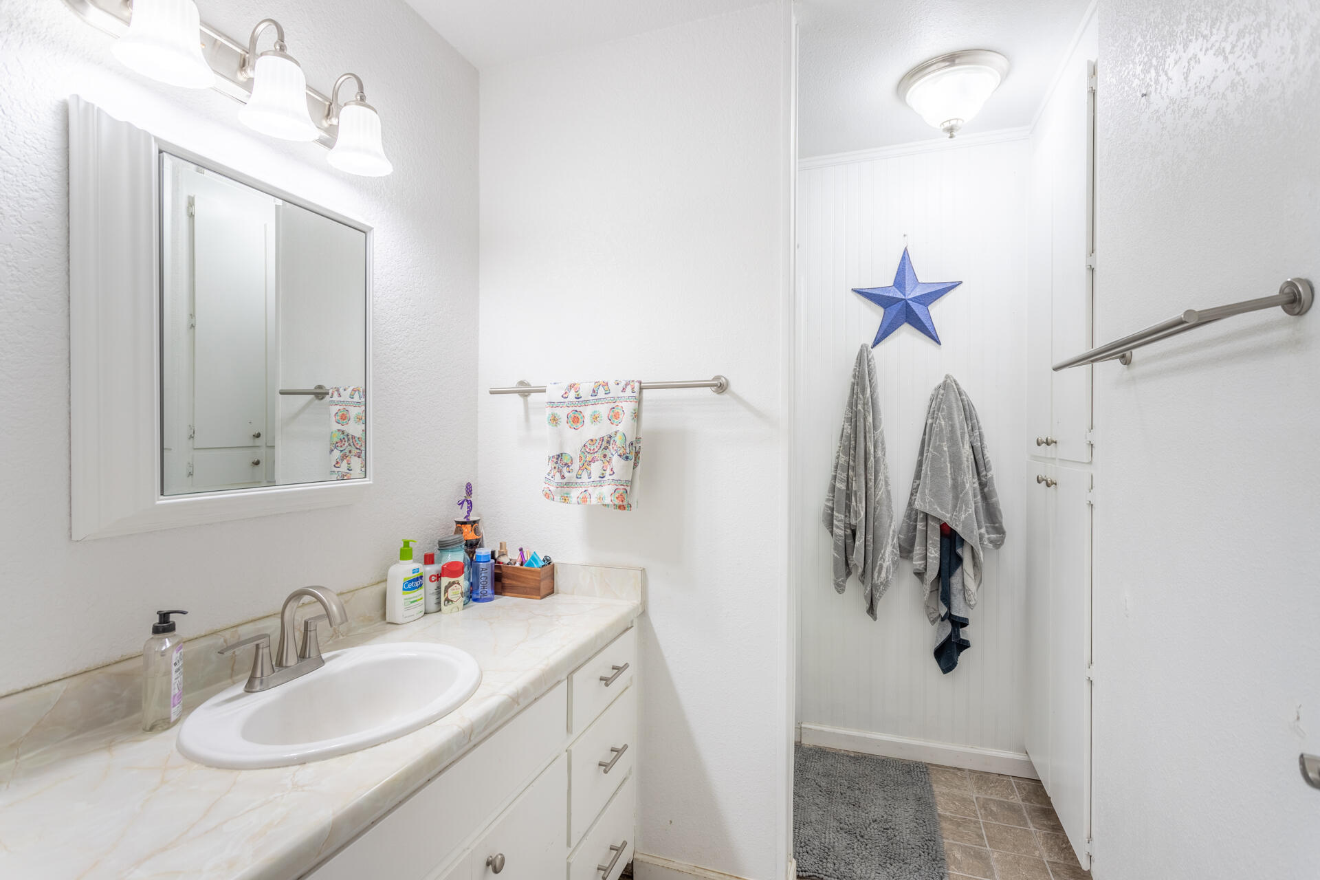 1274 Harpole Road Redding, CA 96002 - Photo 13 of 27 a bathroom with a sink vanity and a mirror