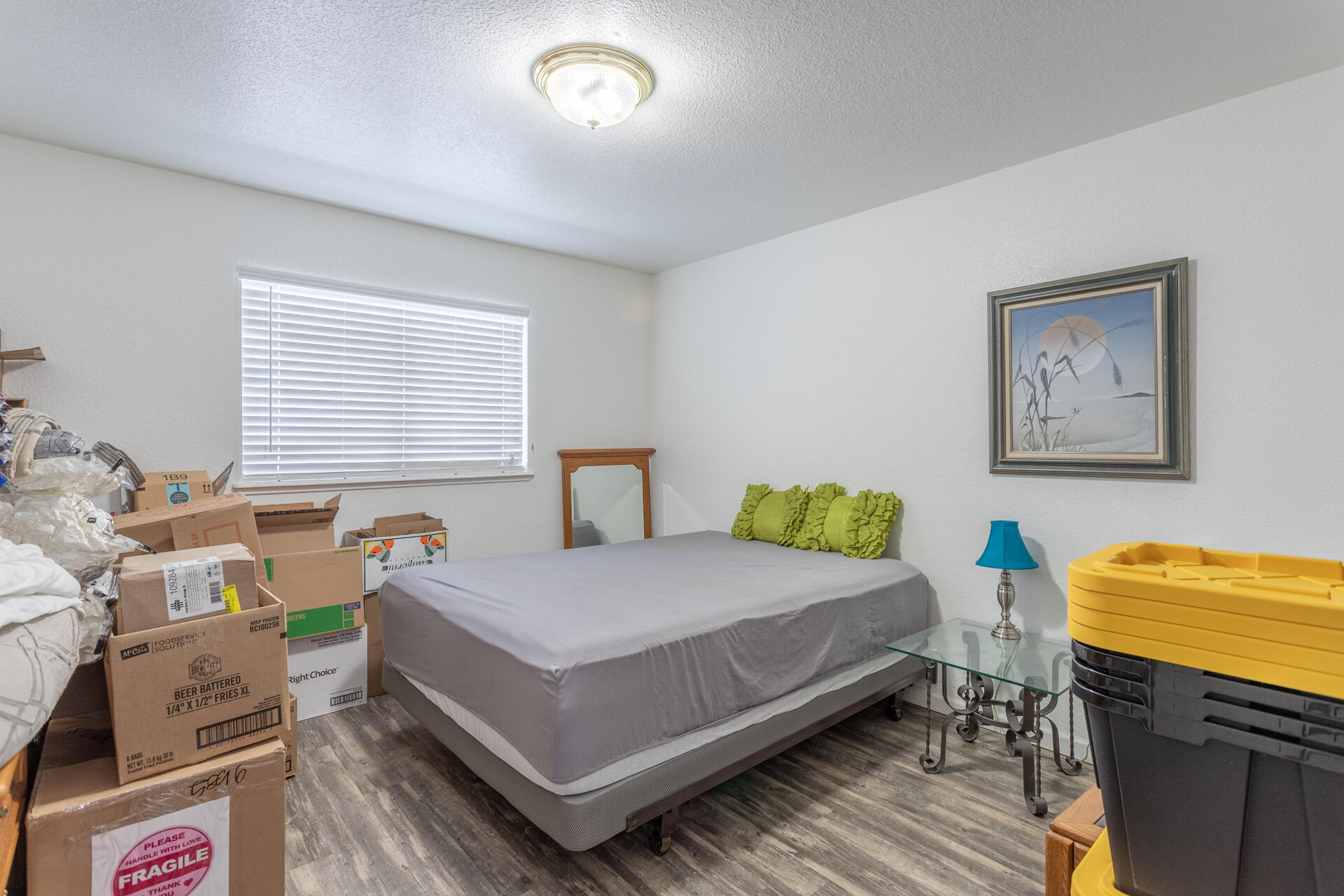 1274 Harpole Road Redding, CA 96002 - Photo 15 of 27 a bedroom with a bed and wooden floor