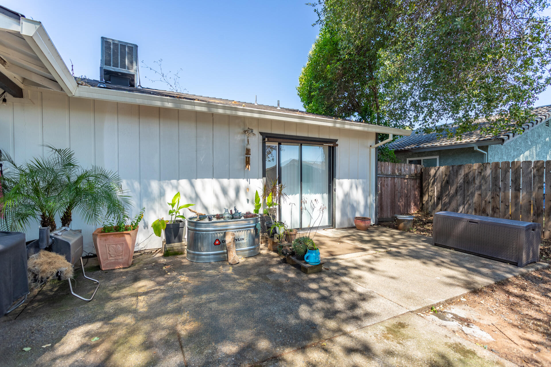 1274 Harpole Road Redding, CA 96002 - Photo 21 of 27 a view of a backyard with sitting area and furniture