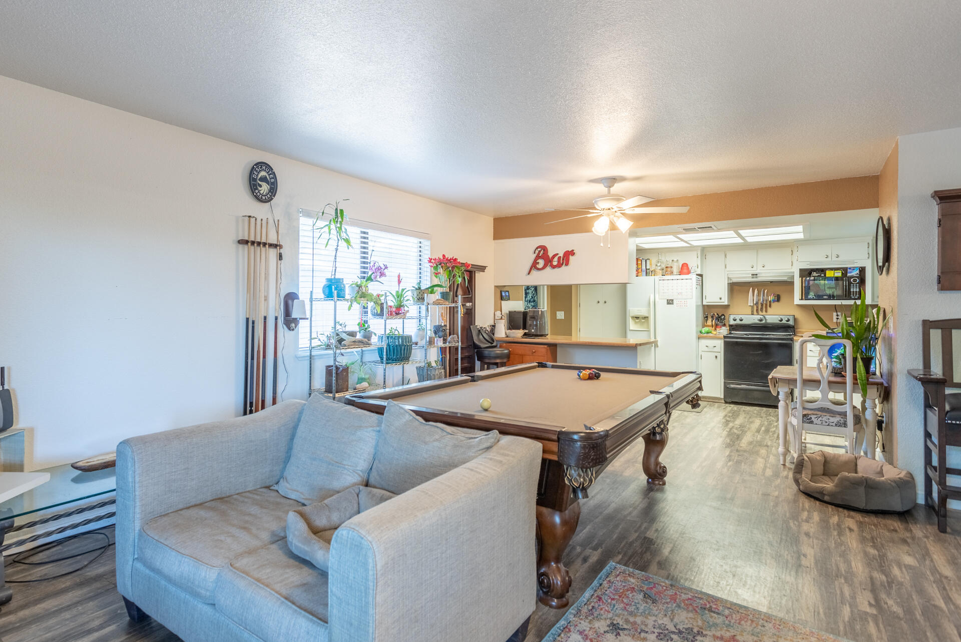 1274 Harpole Road Redding, CA 96002 - Photo 7 of 27 a living room with furniture a flat screen tv and a table