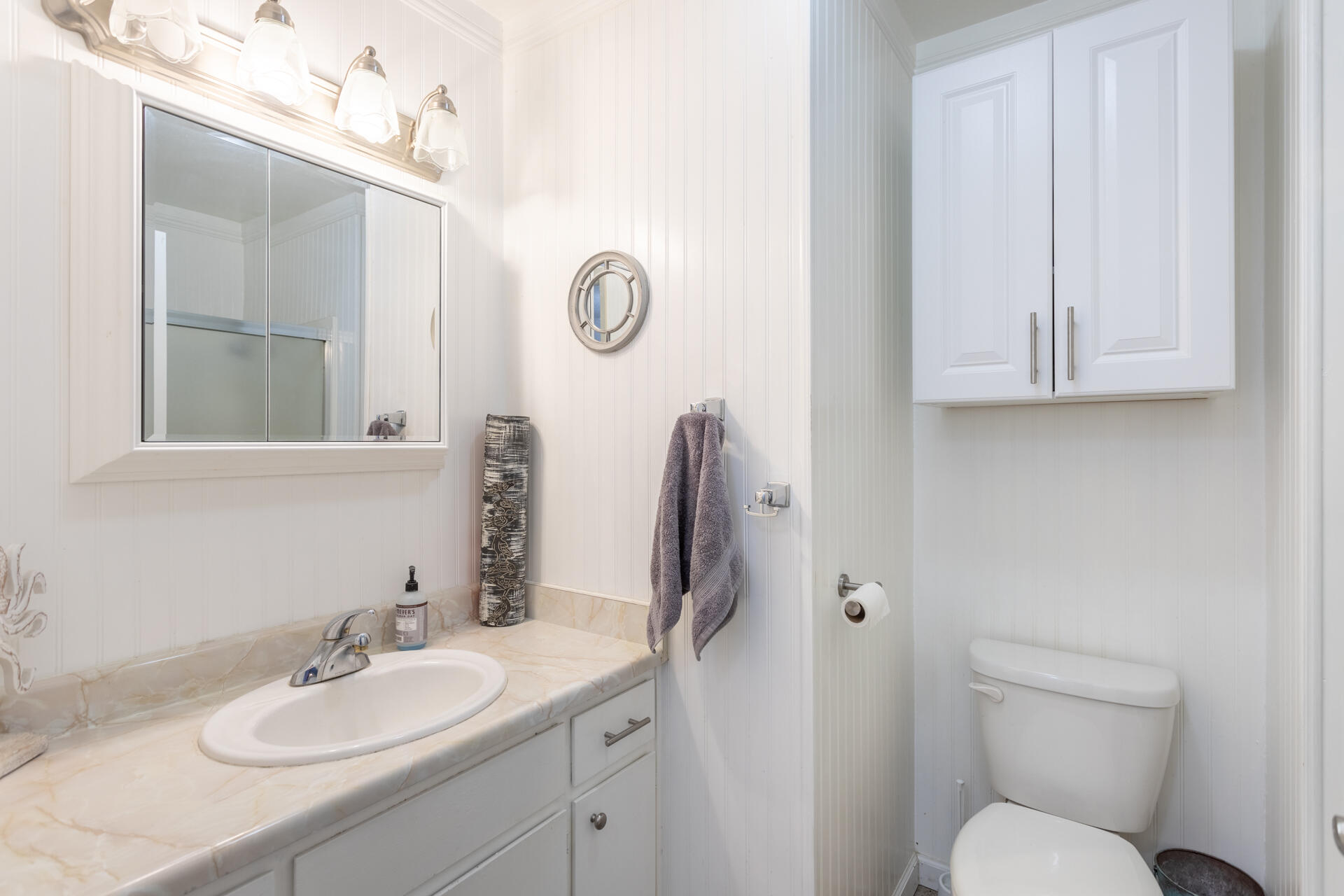 1274 Harpole Road Redding, CA 96002 - Photo 10 of 27 a bathroom with a toilet sink and mirror