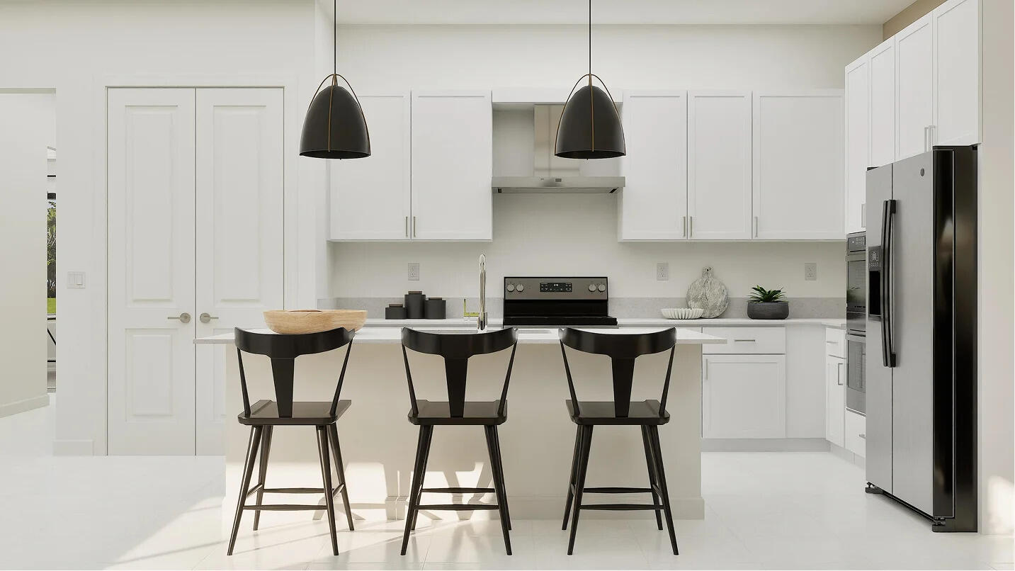 1022 Raleigh Way Wellington, FL 33449 - Photo 2 of 16 a kitchen with stainless steel appliances kitchen island granite countertop a table chairs microwave and cabinets