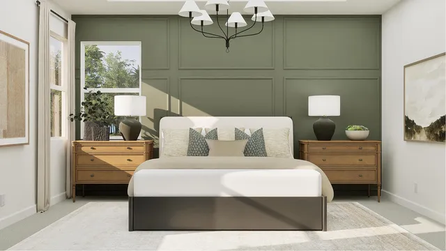 a bedroom with a large bed and a chandelier