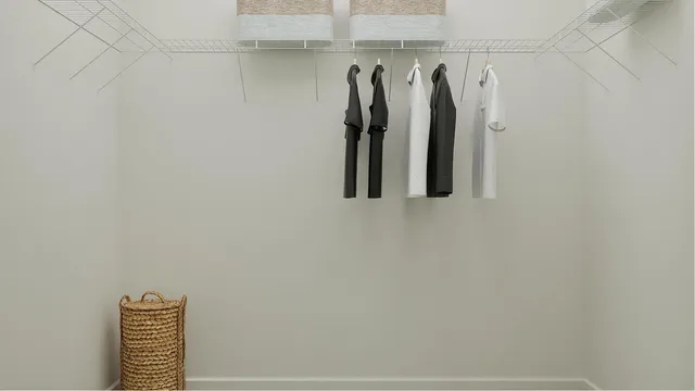 a view of walk in closet with clothes