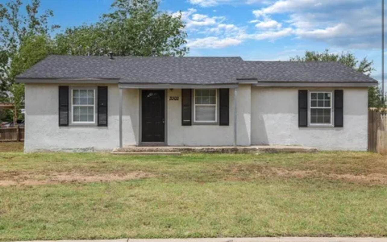 3302 Bates Street Lubbock, TX 79415 - Photo 1 of 9 a house with yard in front of it
