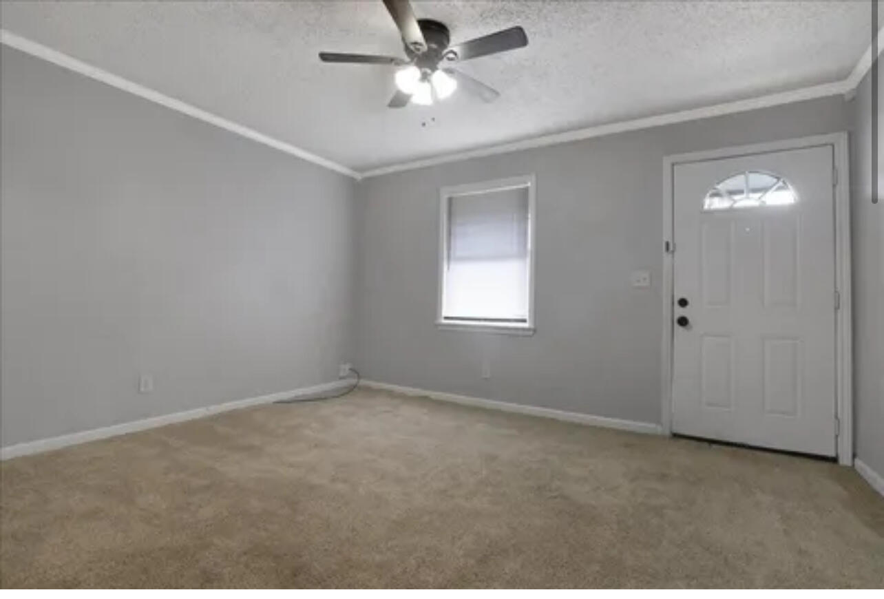 3302 Bates Street Lubbock, TX 79415 - Photo 3 of 9 a view of an empty room with a window