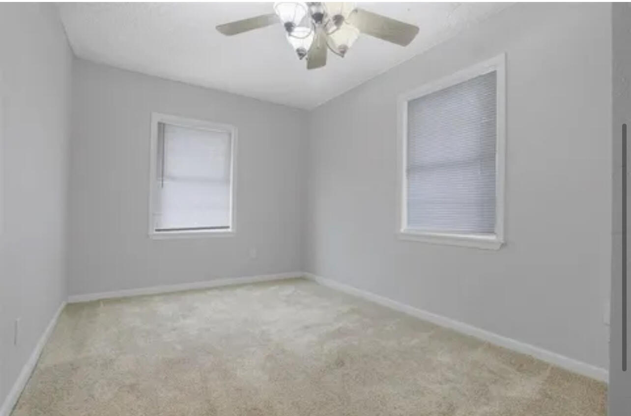 3302 Bates Street Lubbock, TX 79415 - Photo 4 of 9 an empty room with a window