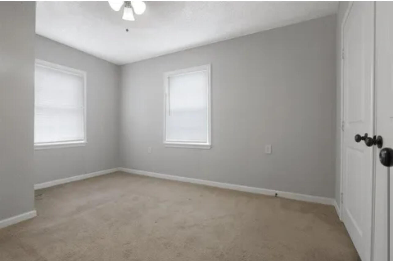 3302 Bates Street Lubbock, TX 79415 - Photo 6 of 9 an empty room with a window