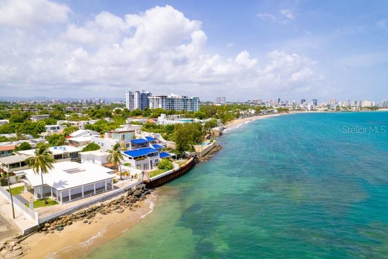 a view of a city with lawn chairs