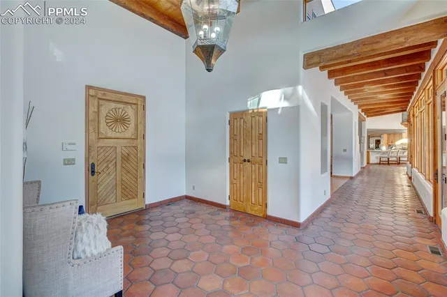 a view of hallway with wooden floor