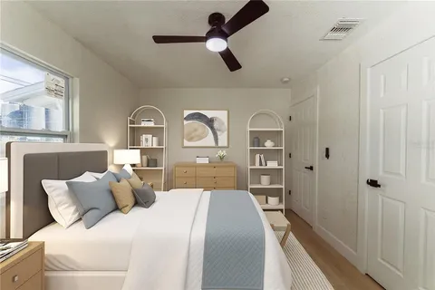 a bedroom with a bed and a window