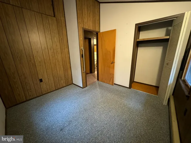 a view of an empty room and a window