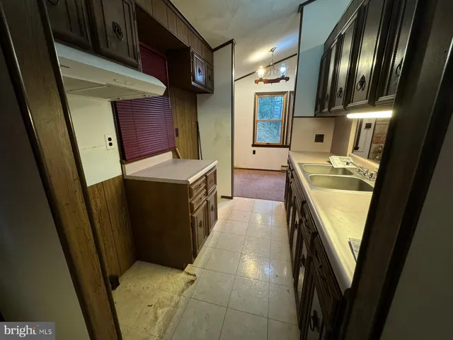 a bathroom with sink and mirror