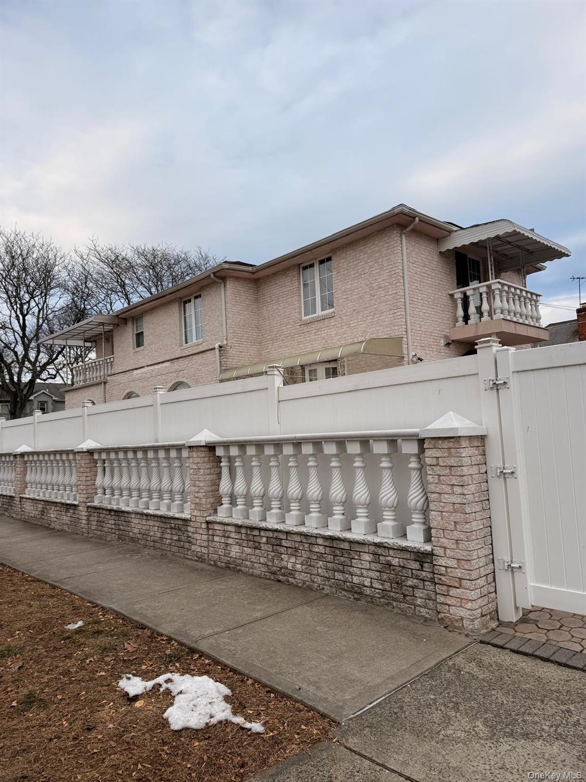 265-04 79th Avenue Queens, NY 11004 - Photo 5 of 5 a view of a house with a wooden fence
