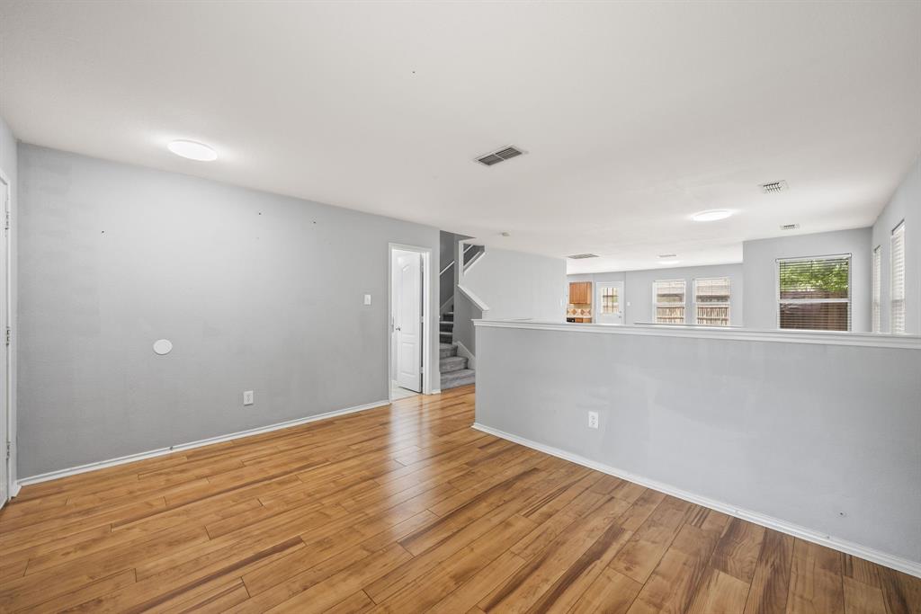601 Amy Way Euless, TX 76039 - Photo 9 of 40 a view of empty room with wooden floor