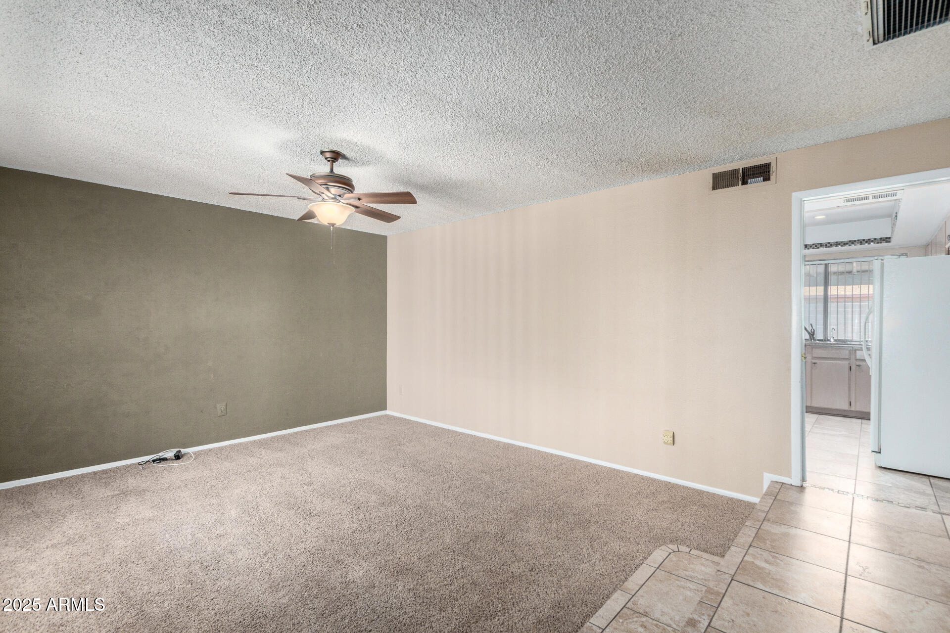 4740 West Bloomfield Road Glendale, AZ 85304 - Photo 5 of 34 a view of a room with a ceiling fan and a window