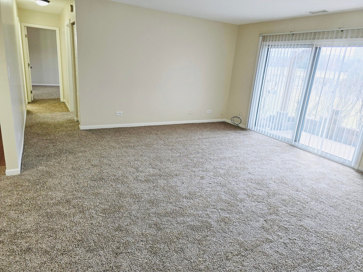 612 Waterford Road South, Unit 1B Schaumburg, IL 60193 - Photo 5 of 10 an empty room with windows
