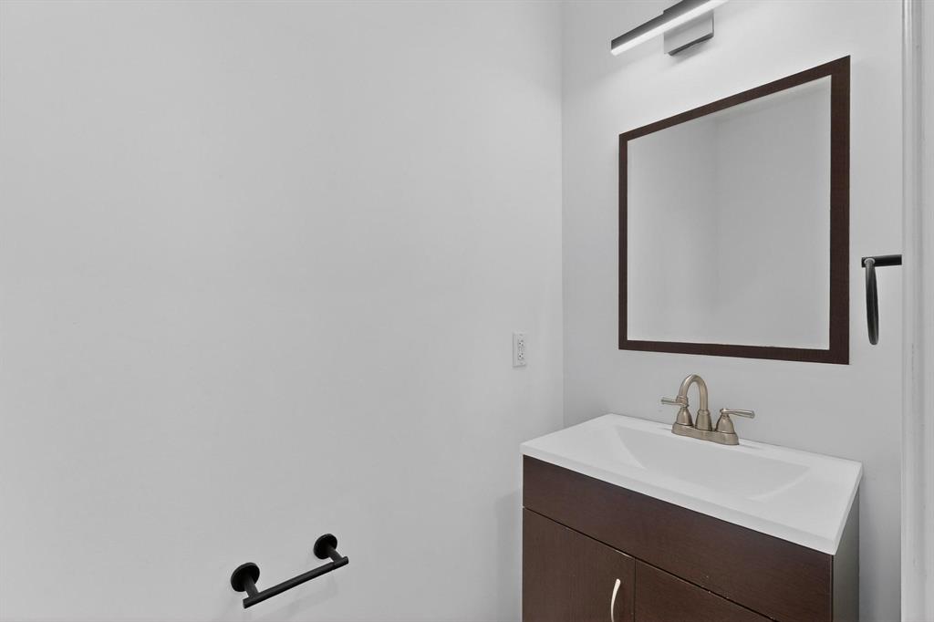 714 Ashbrook Court Euless, TX 76039 - Photo 12 of 30 Conveniently located guest half bath on the main level.