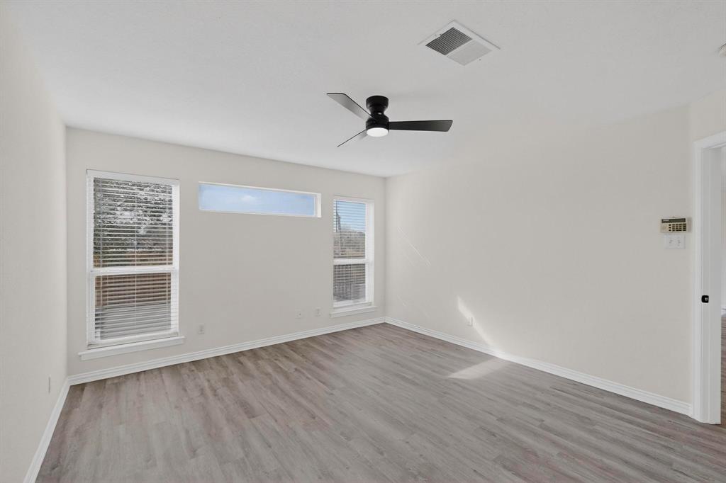 714 Ashbrook Court Euless, TX 76039 - Photo 15 of 30 Generously sized primary suite offering comfort, privacy, and plenty of natural light.