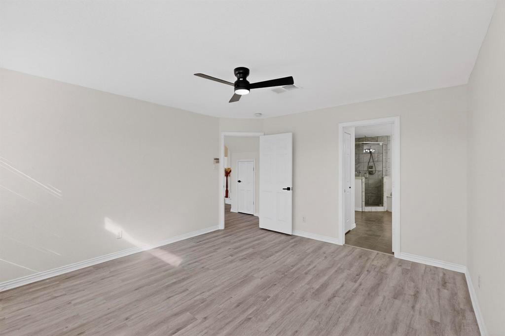 714 Ashbrook Court Euless, TX 76039 - Photo 16 of 30 Generously sized primary suite offering comfort, privacy, and plenty of natural light.