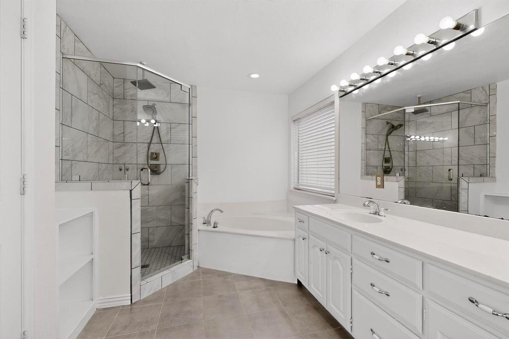 714 Ashbrook Court Euless, TX 76039 - Photo 17 of 30 Well-appointed primary bath designed for comfort and convenience.