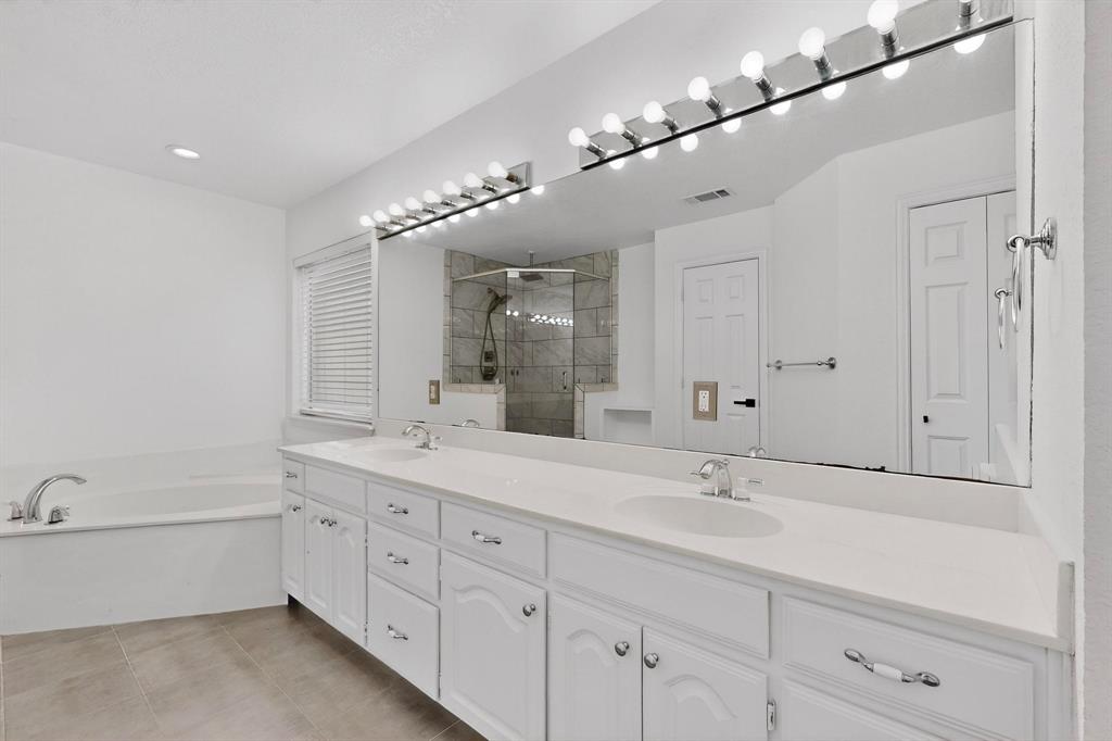714 Ashbrook Court Euless, TX 76039 - Photo 18 of 30 Well-appointed primary bath designed for comfort and convenience.