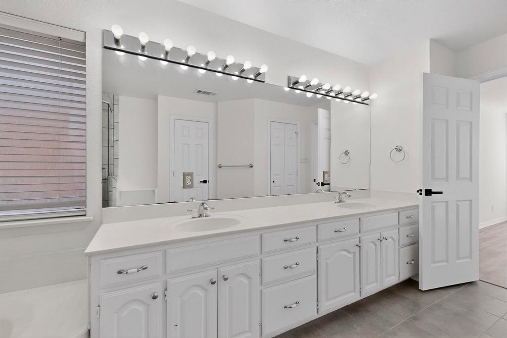 714 Ashbrook Court Euless, TX 76039 - Photo 19 of 30 Well-appointed primary bath designed for comfort and convenience.