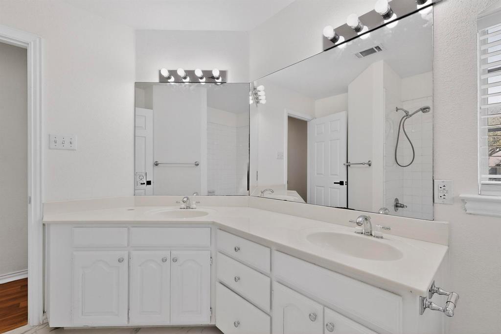 714 Ashbrook Court Euless, TX 76039 - Photo 25 of 30 Full bathroom upstairs serving the secondary bedrooms.