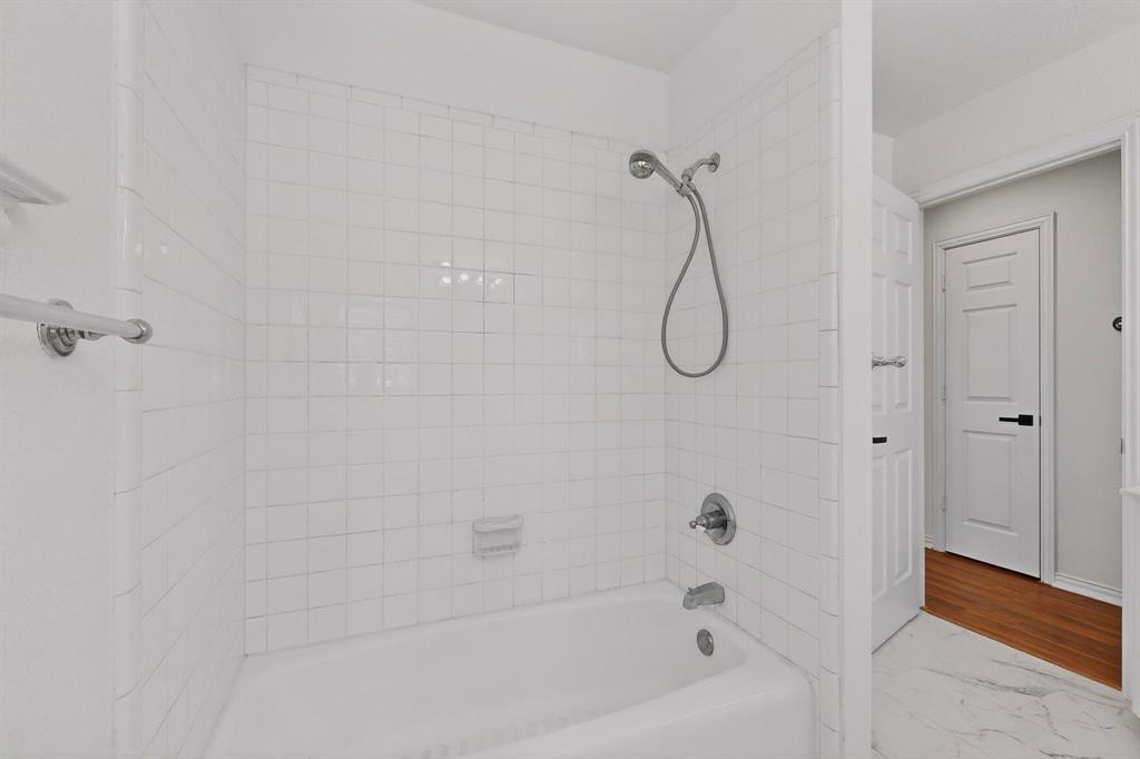 714 Ashbrook Court Euless, TX 76039 - Photo 26 of 30 Full bathroom upstairs serving the secondary bedrooms.