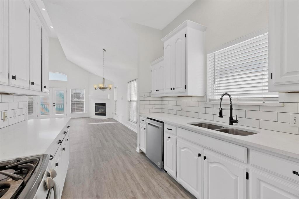 714 Ashbrook Court Euless, TX 76039 - Photo 8 of 30 The fresh new kitchen shines with updated cabinetry, stylish finishes, and ample prep space — designed for both everyday living and hosting.