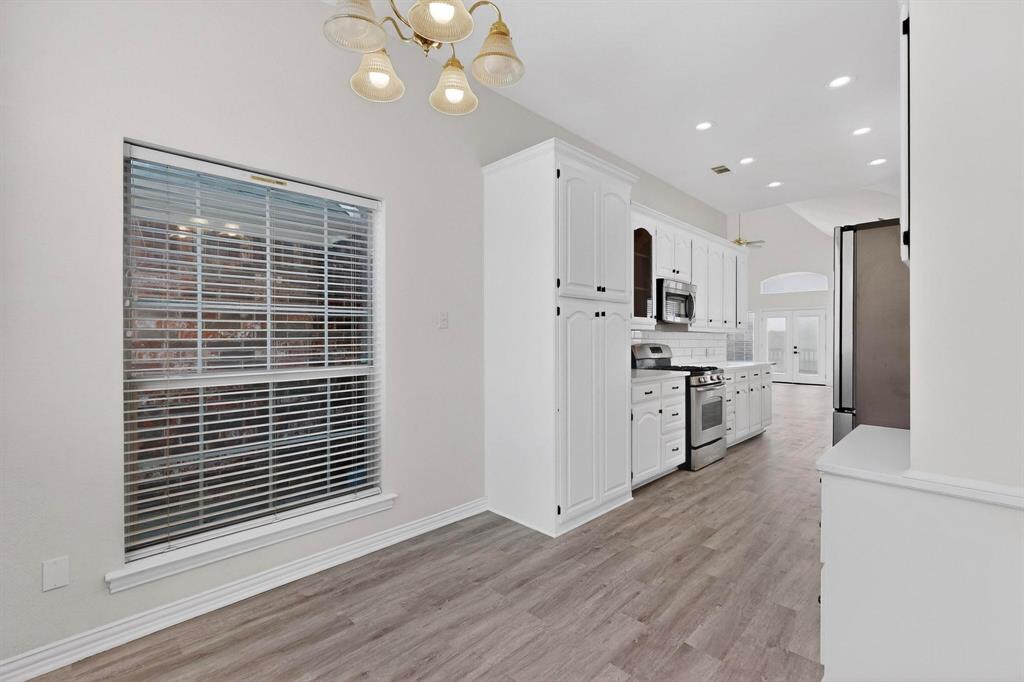 714 Ashbrook Court Euless, TX 76039 - Photo 10 of 30 The fresh new kitchen boasts stylish finishes, updated cabinetry, and a functional layout ideal for gatherings.