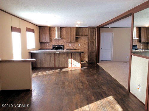 3914 Cherokee Road Wilson, NC 27893 - Photo 8 of 21 Living Room view 2 - Looking towards the Kitchen