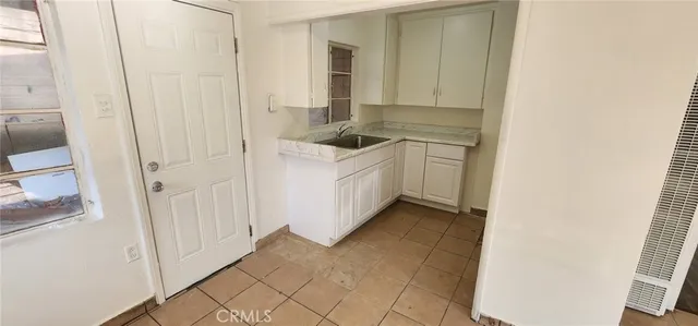 a bathroom with a sink a mirror and a shower