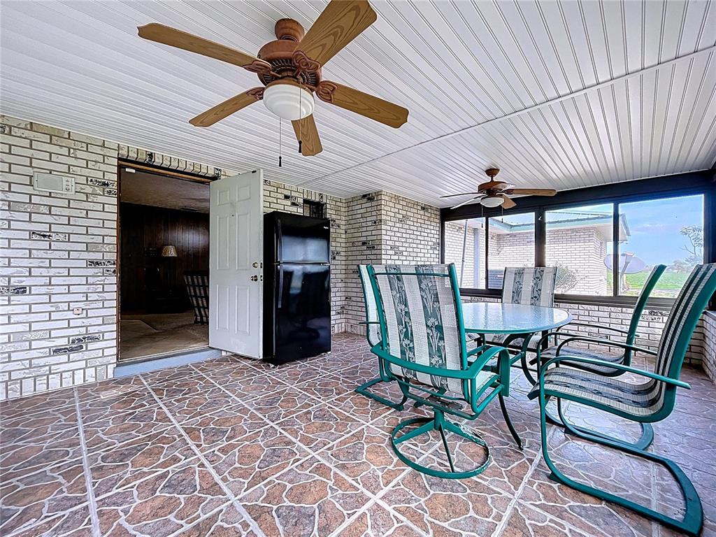 9471 McIntosh Road Dover, FL 33527 - Photo 18 of 34 a view of a dining room with furniture window and outside view