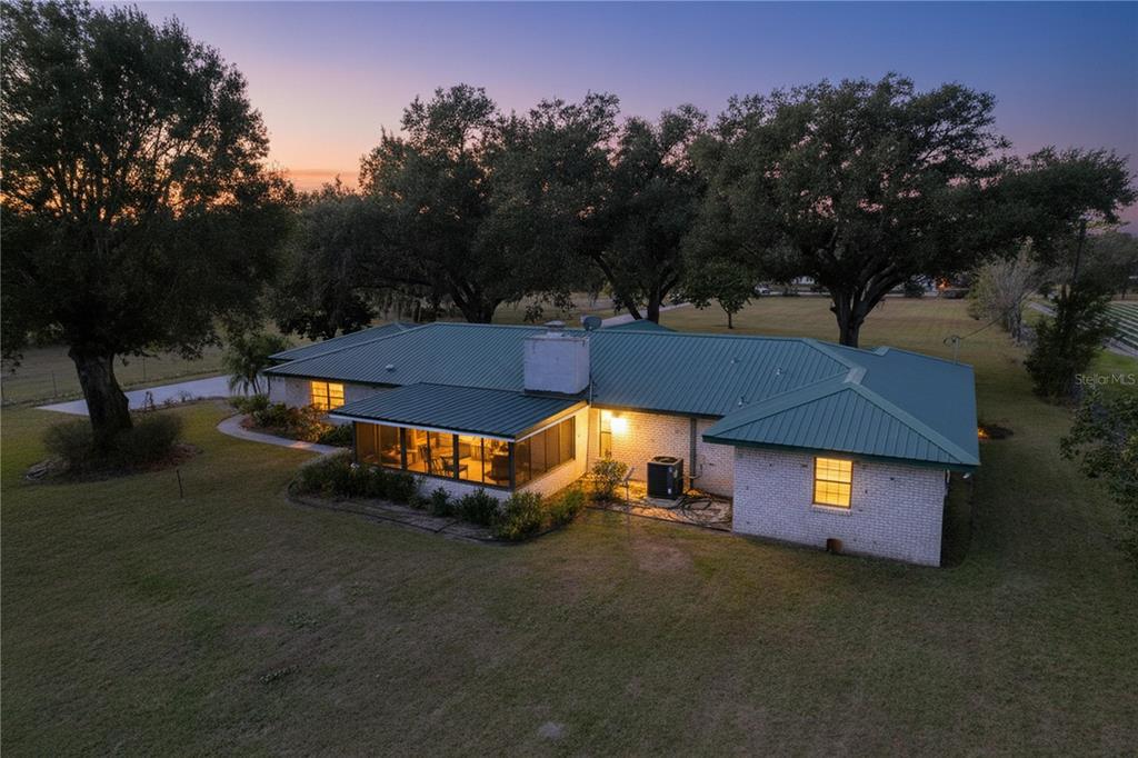 9471 McIntosh Road Dover, FL 33527 - Photo 2 of 34 a view of a house with a yard