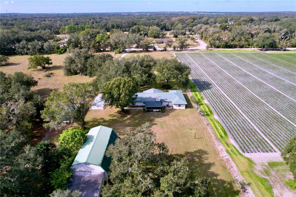 9471 McIntosh Road Dover, FL 33527 - Photo 34 of 34 an aerial view of a house with yard swimming pool and outdoor seating