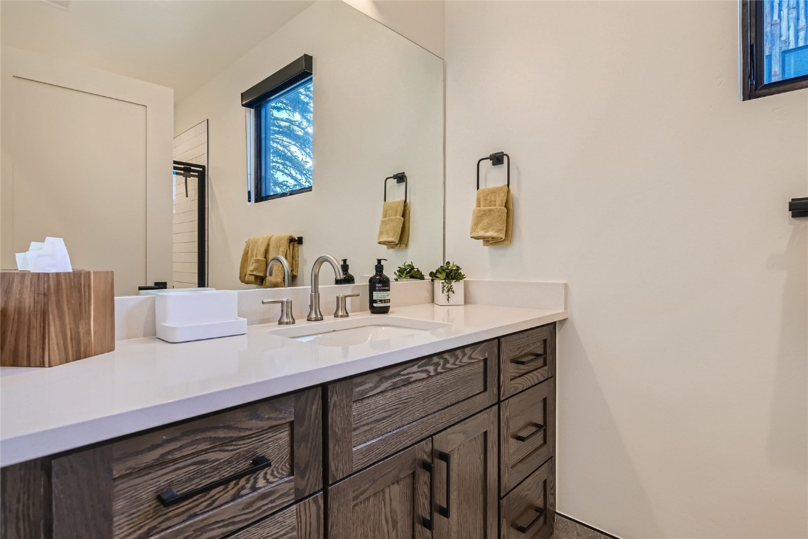 46 6th Street, Unit A1 Silverthorne, CO 80498 - Photo 15 of 28 a bathroom with a sink and a mirror