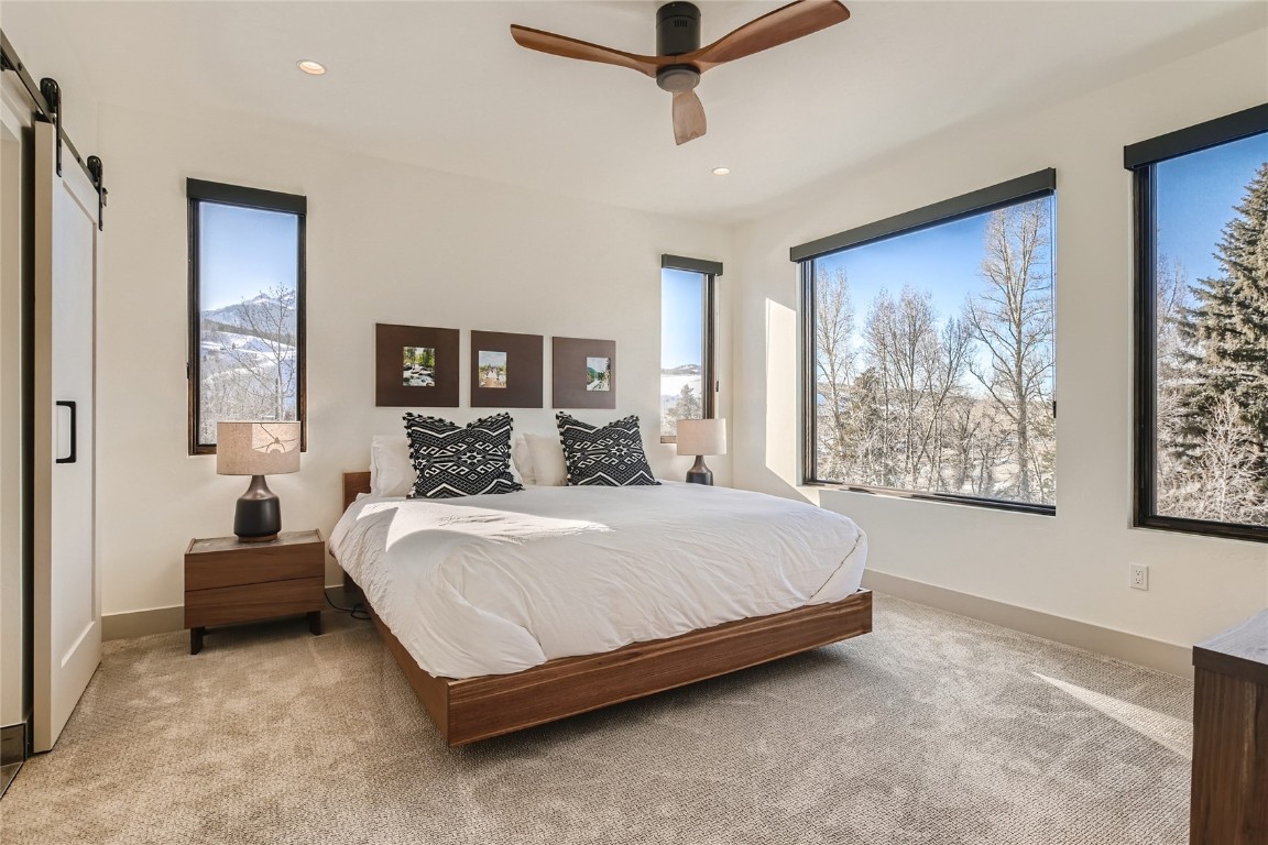 46 6th Street, Unit A1 Silverthorne, CO 80498 - Photo 16 of 28 a spacious bedroom with a bed and window