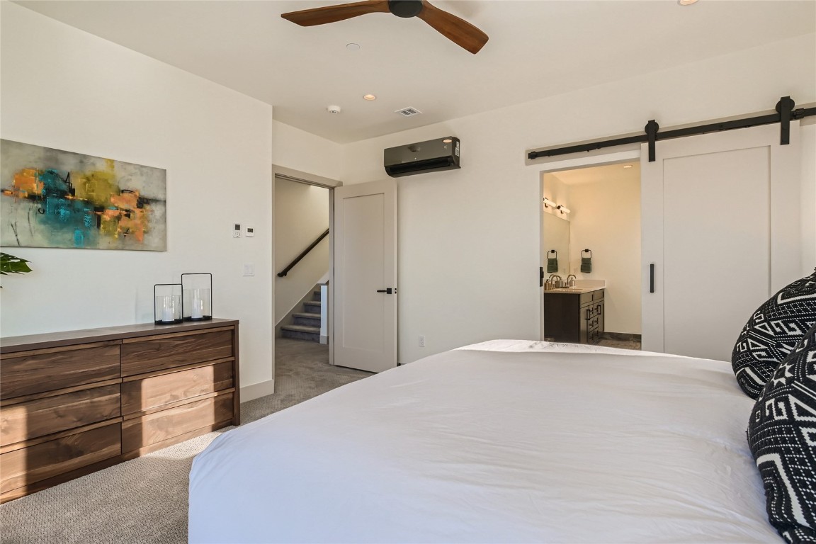 46 6th Street, Unit A1 Silverthorne, CO 80498 - Photo 17 of 28 a bedroom with a bed and a chandelier