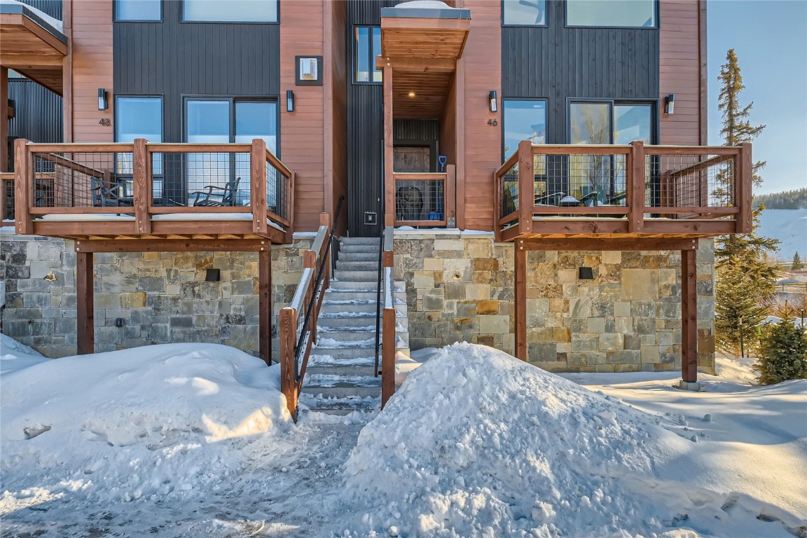 46 6th Street, Unit A1 Silverthorne, CO 80498 - Photo 3 of 28 a view of a house with wooden stairs