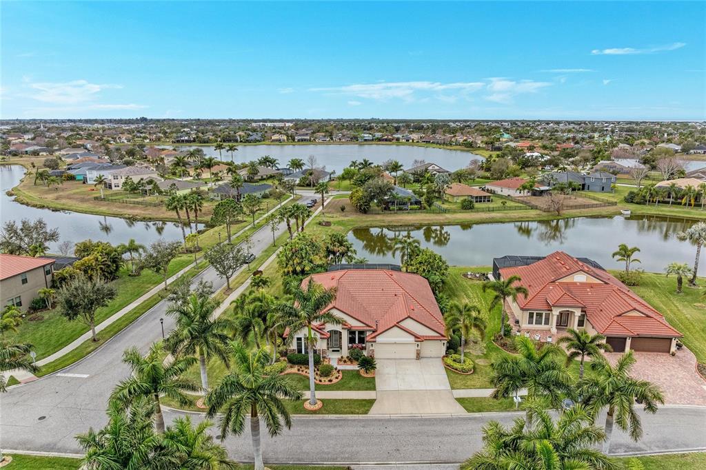 302 Cockle Shell Loop Apollo Beach, FL 33572 - Photo 72 of 75 an aerial view of a house with a lake view