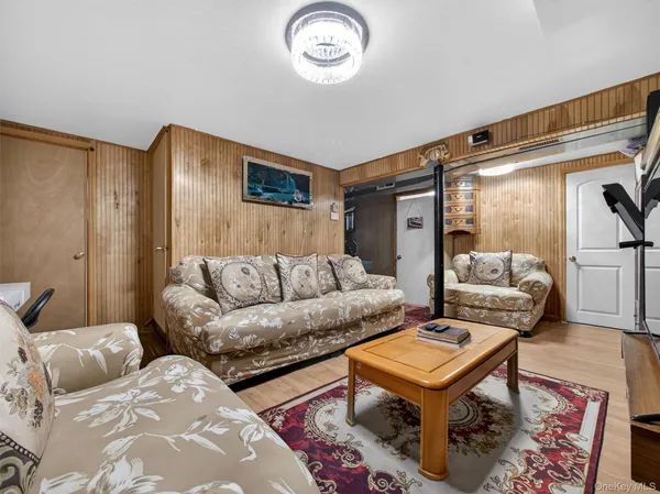 a living room with furniture and a rug