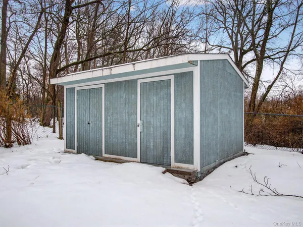 a view of a house with a snow in the yard