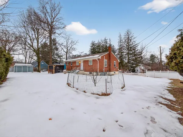 a view of residential house with a yard