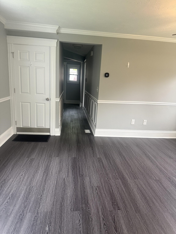 25 Chester Street Worcester, MA 01605 - Photo 4 of 8 a view of a room with wooden floor and window